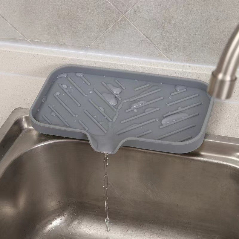 Quick-drying anti-slip mat for kitchen and bathroom with drain spout